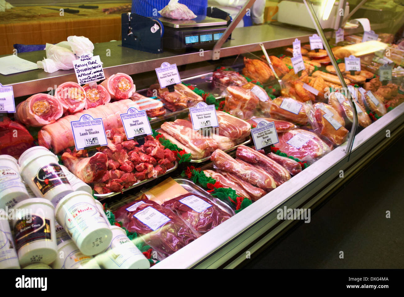 Refrigerated Meat Display In Butchers Shop Stock Photo