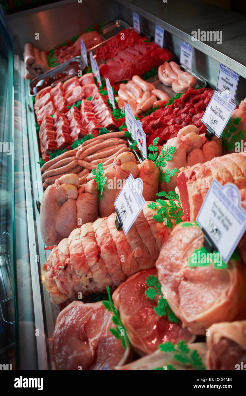 Refrigerated Meat Display In Butchers Shop Stock Photo