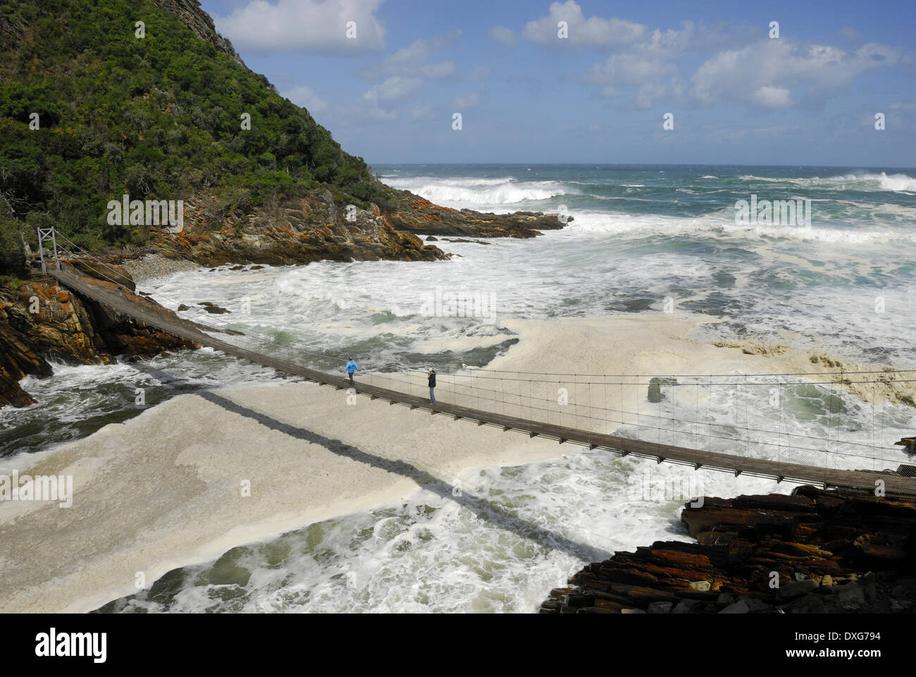 Suspension bridge and breakers at Storms River Mouth, Western Cape, South Africa Stock Photo