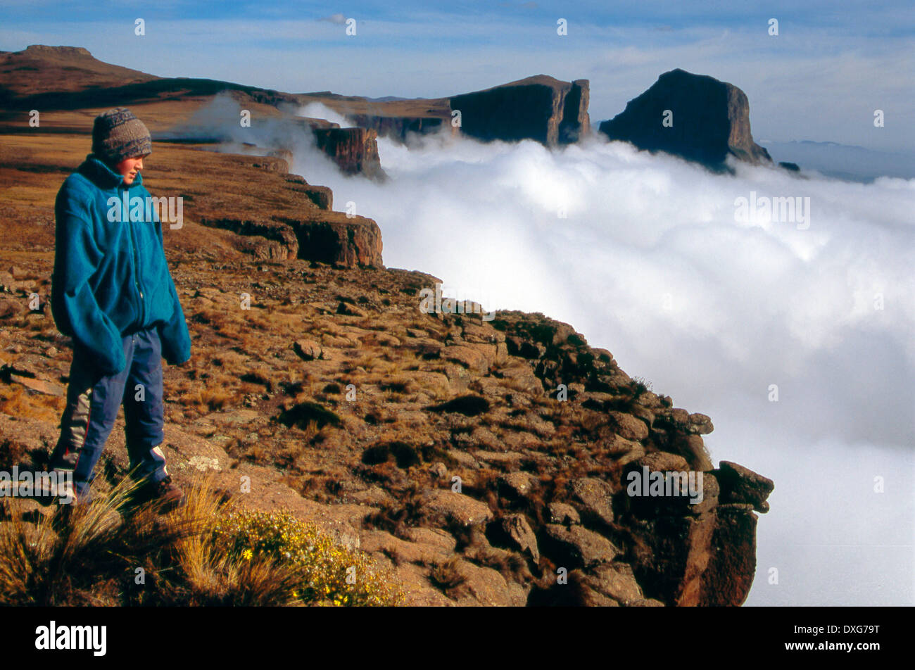 Clouds below The Amphitheatre, Drakensberg. The Sentinel in the background. Stock Photo