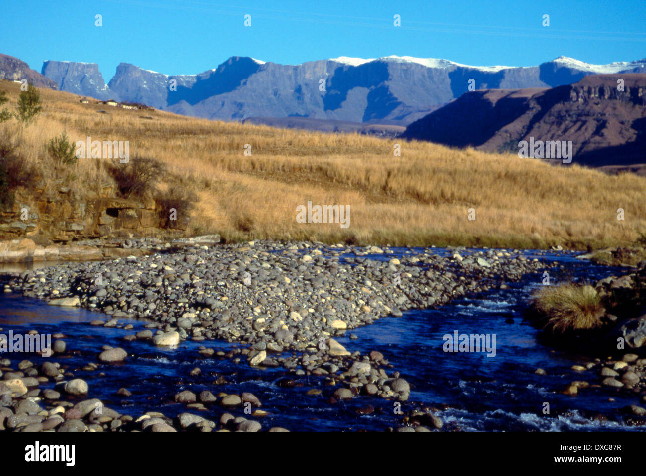 Winter view up the Ndedema River towards Cathkin Peak Stock Photo