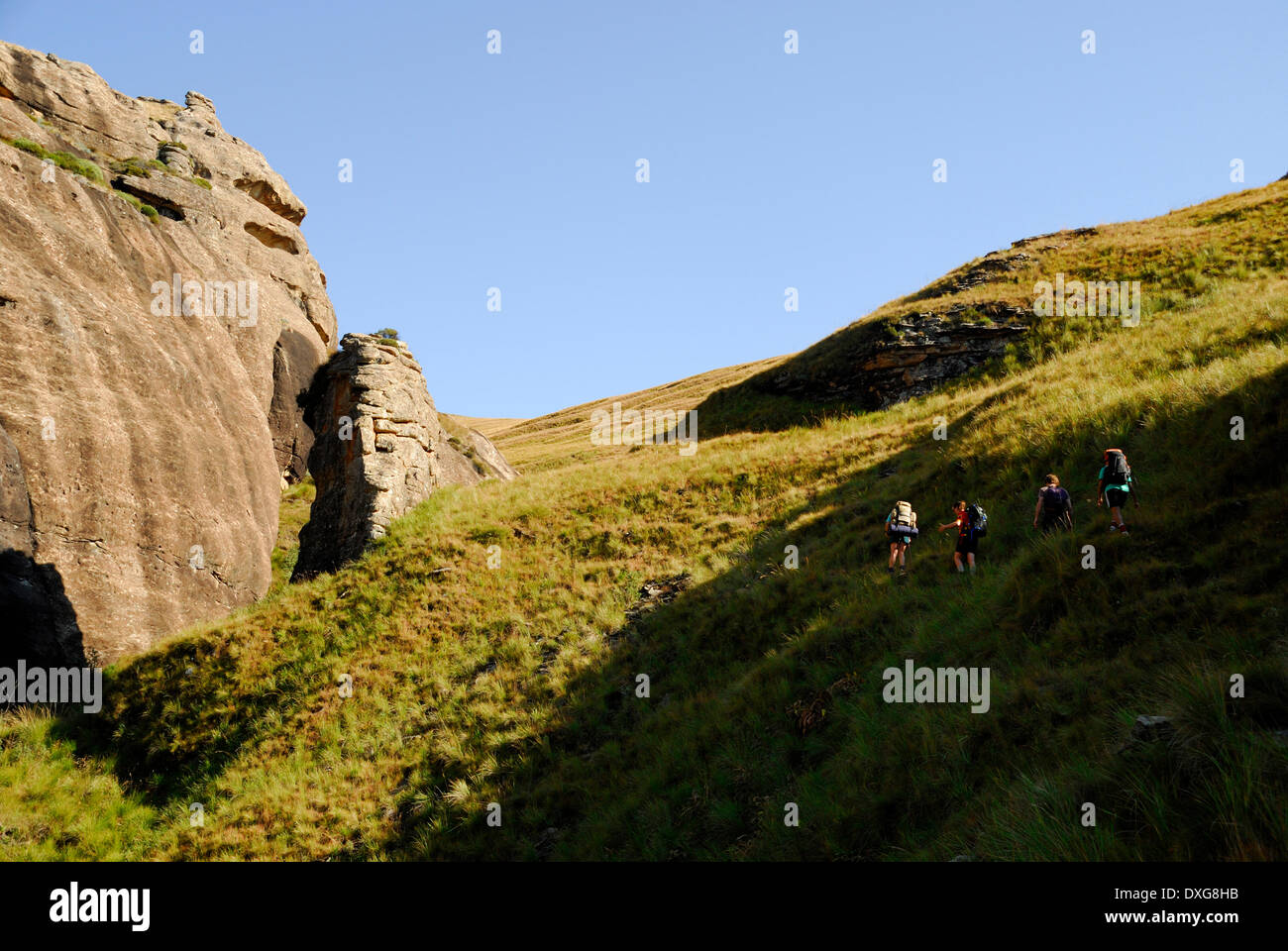 Hiking up from White Horse Cave, southern Drakensberg mountains Stock