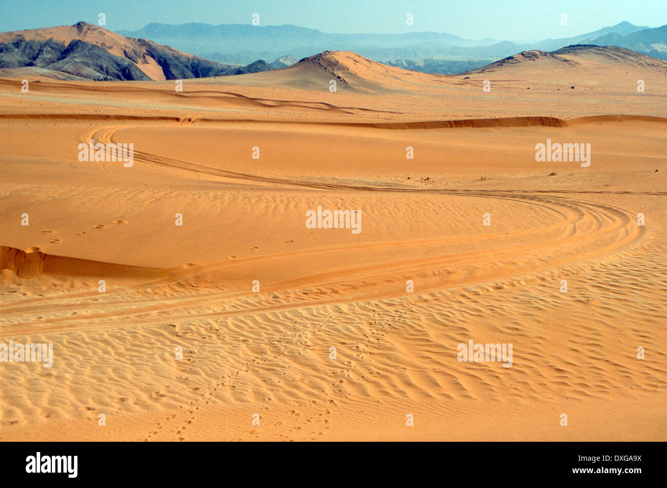 Vehicle track curving through sand dunes, Hartmann Valley, Kaokoland, Namibia Stock Photo Alamy