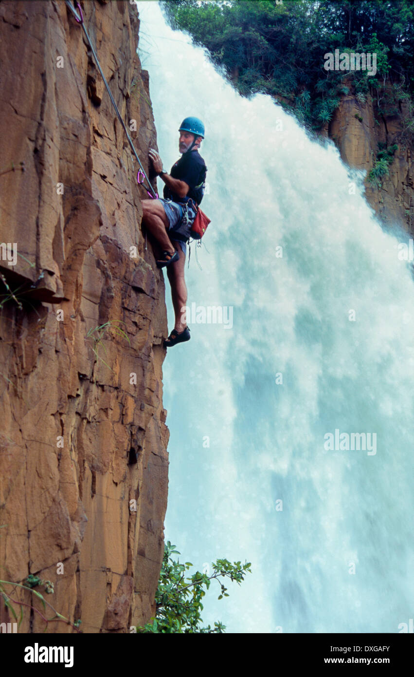 Rock climbing at Howick Falls with the Umngeni River in full spate