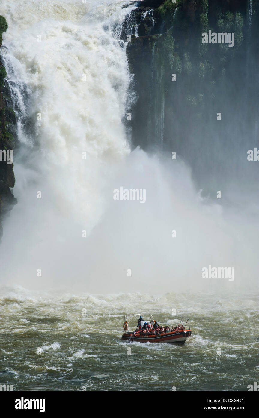 Jetboat underneath the Iguazú Falls, Iguazú National Park, UNESCO World Heritage Site, Argentina Stock Photo