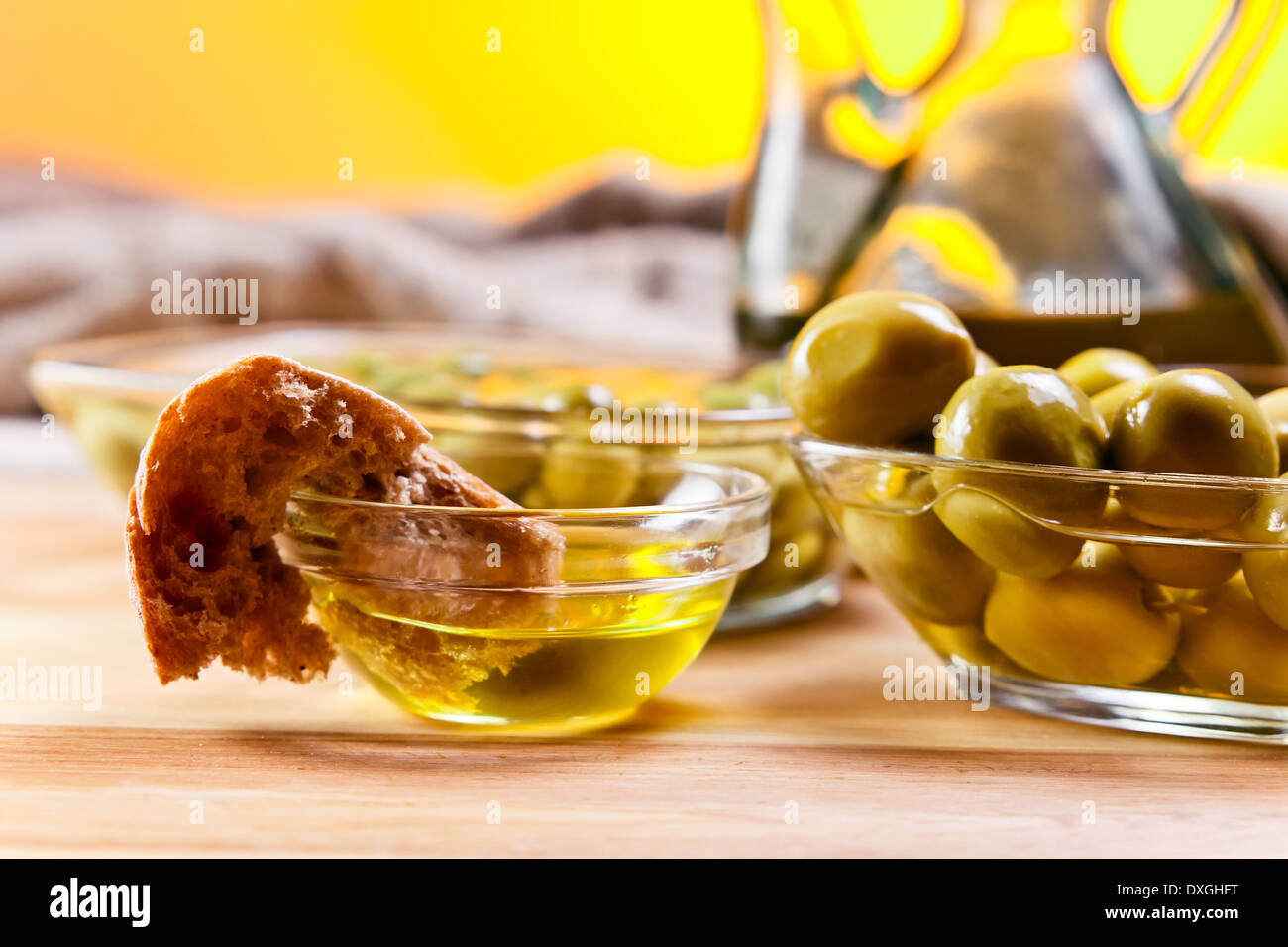olive oil and olives on wooden table Stock Photo - Alamy
