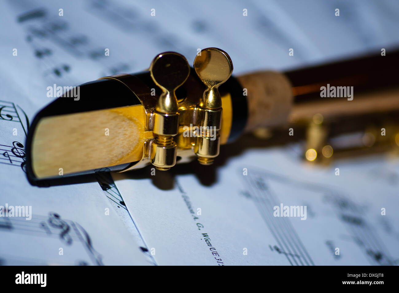 A soprano saxophone lying on sheet music Stock Photo
