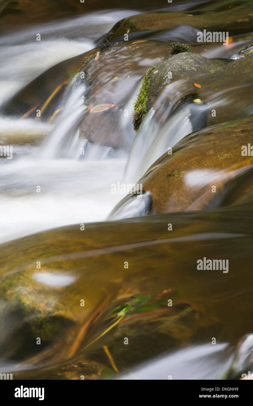 Water flowing over rocks, Islay Stock Photo