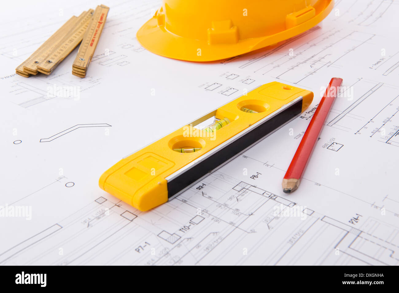 Hard hat and tools on a blueprint Stock Photo