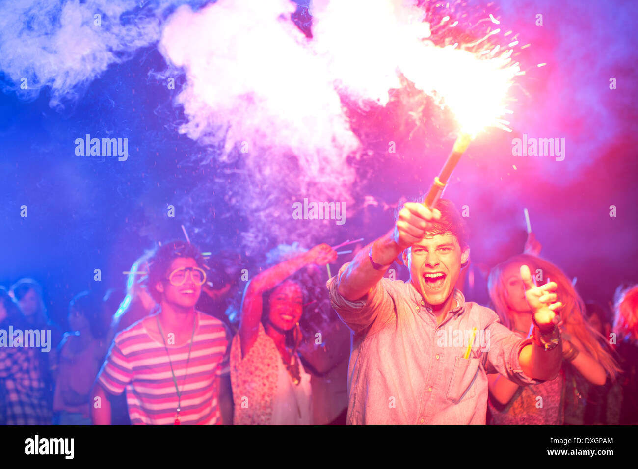 Fans with fireworks at music festival Stock Photo