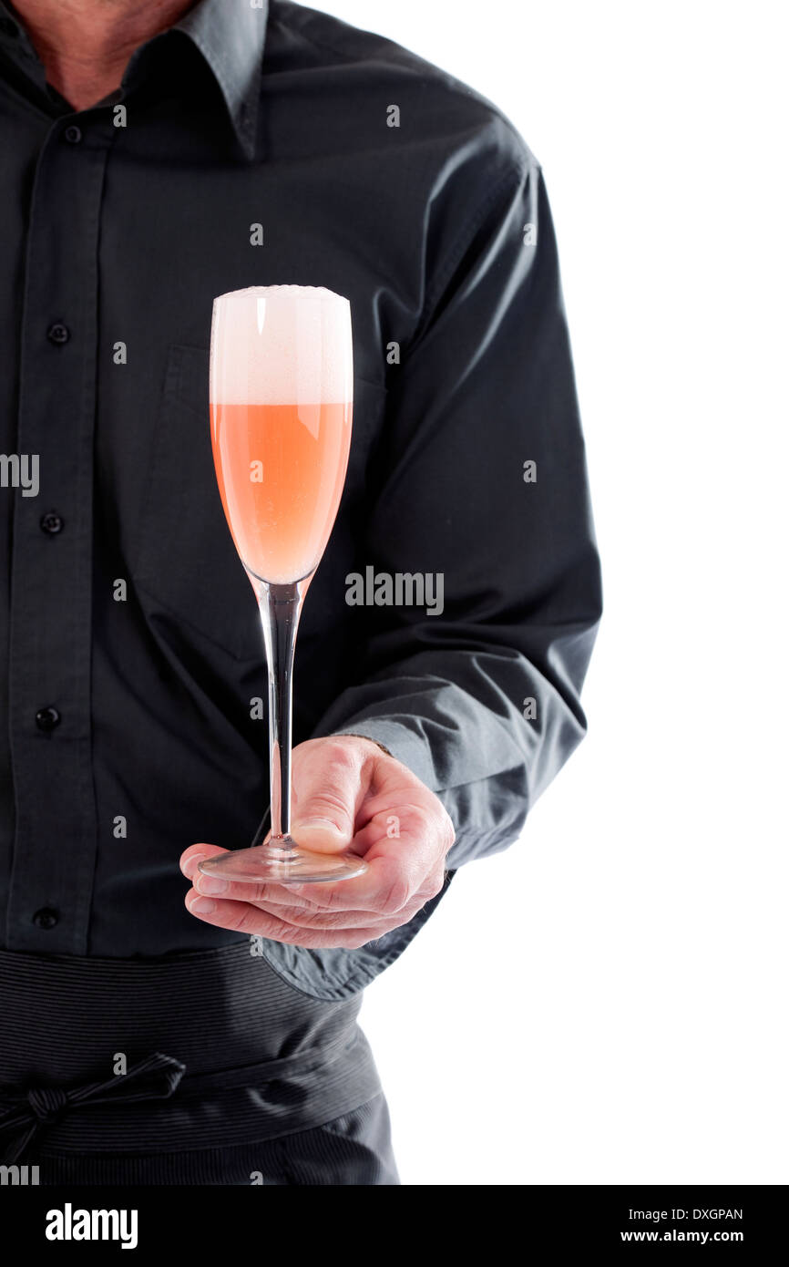 Server holding cocktail glass Stock Photo