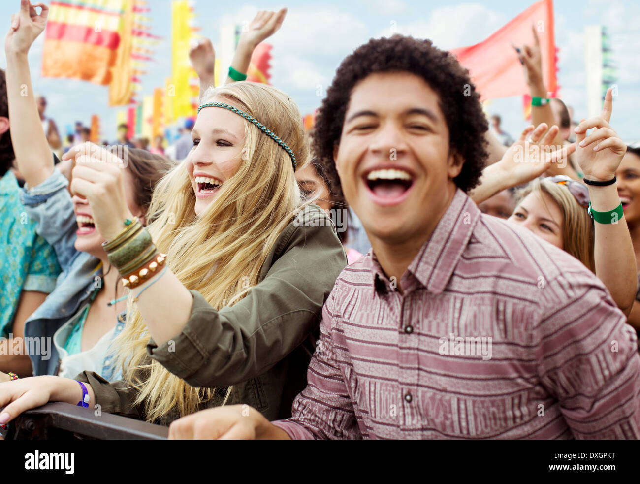 Fans cheering at music festival Stock Photo