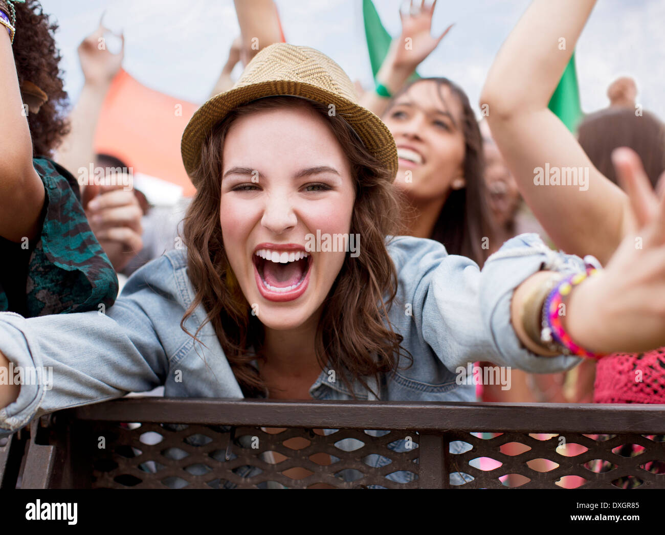 Close up of cheering woman at music festival Stock Photo