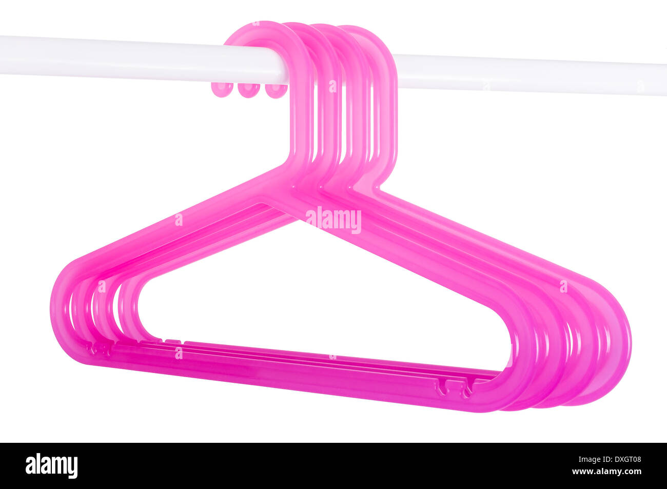 Pink plastic hangers hanging on a rod isolated on white background Stock Photo