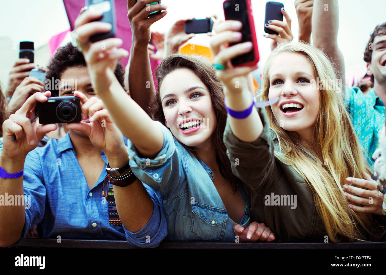 Fans with cameras and camera phones at music festival Stock Photo