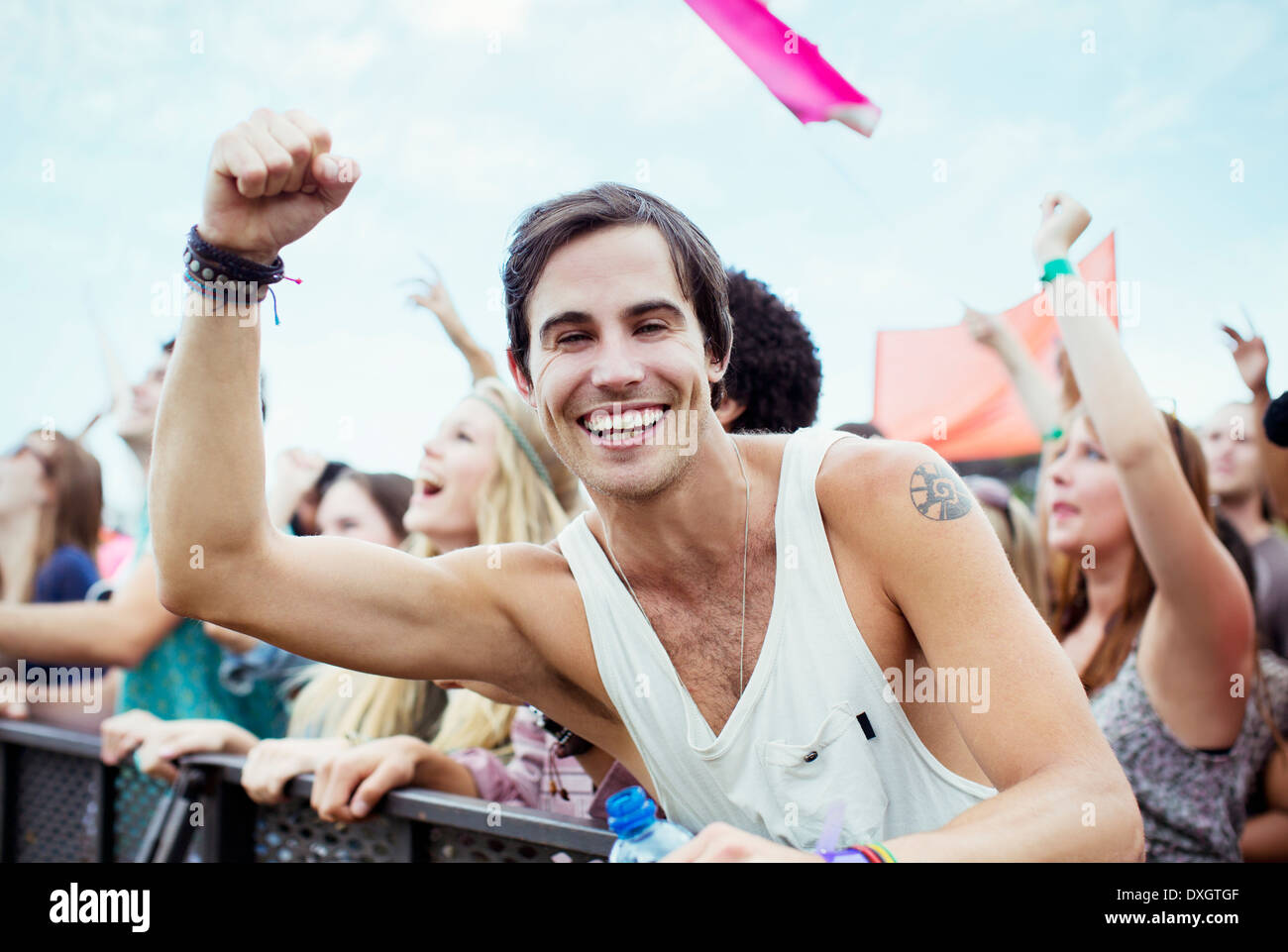 Enthusiastic man cheering at music festival Stock Photo