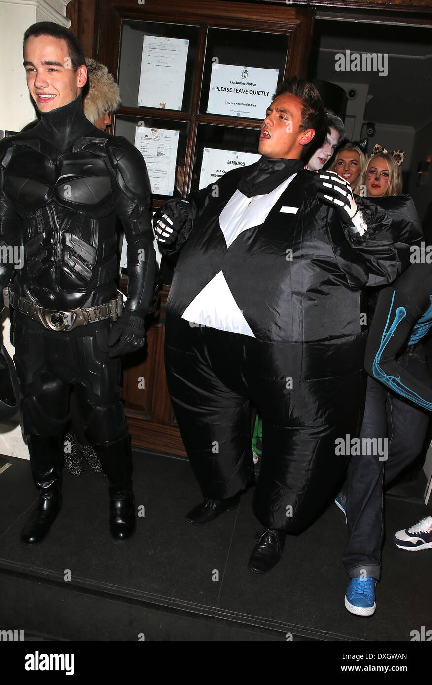 Liam Payne of One Direction dressed as Batman and Tom Daley in a fat skeleton costume Celebrities at Funky Buddha nightclub for a Halloween party London, England - 28.10.12 Where: London, LONDON, United Kingdom When: 28 Oct 2012 Stock Photo