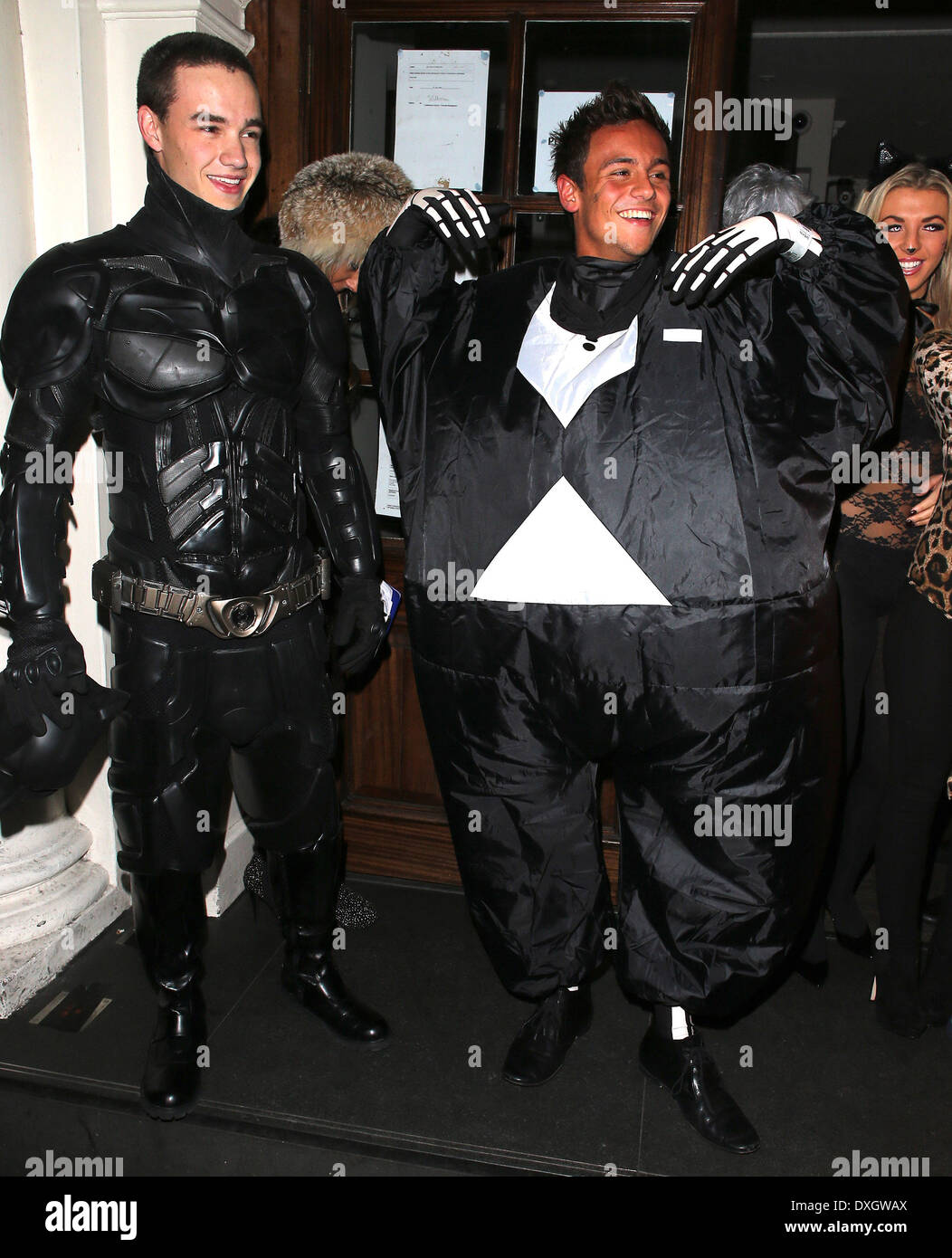 Liam Payne of One Direction dressed as Batman and Tom Daley in a fat skeleton costume Celebrities at Funky Buddha nightclub for a Halloween party London, England - 28.10.12 Where: London, LONDON, United Kingdom When: 28 Oct 2012 Stock Photo