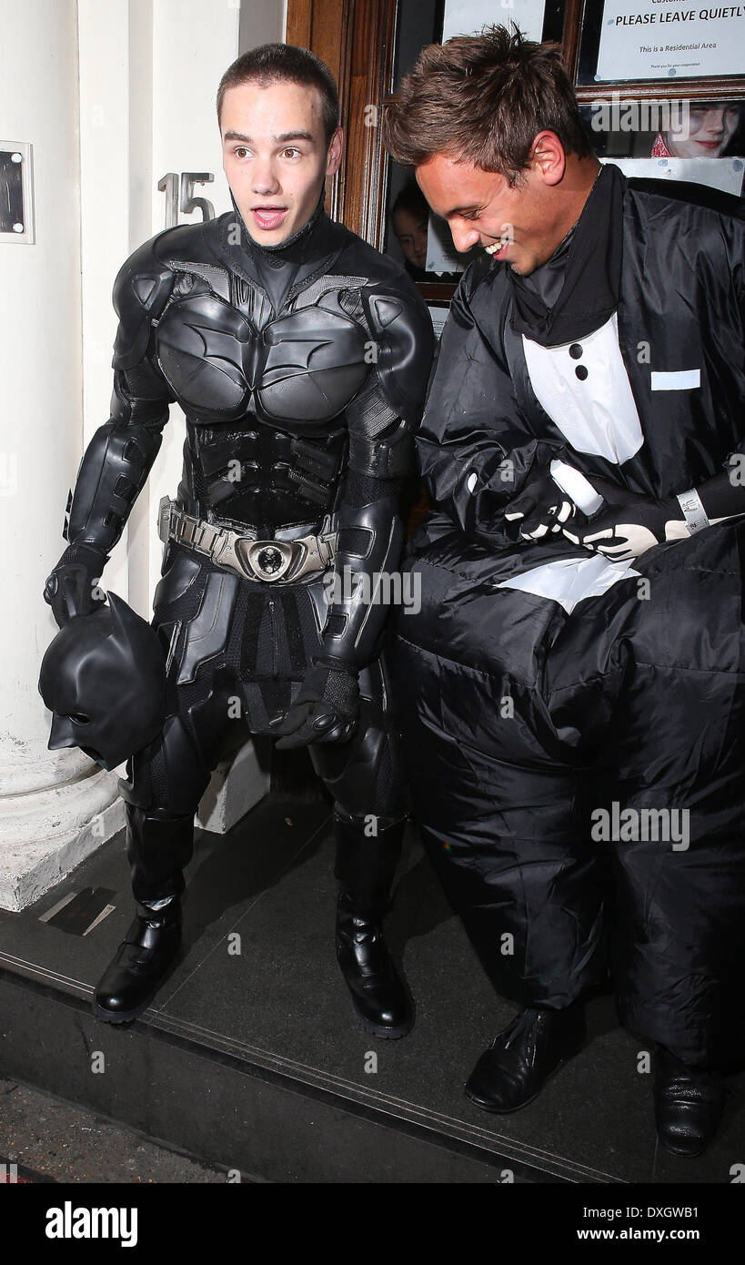Liam Payne of One Direction dressed as Batman and Tom Daley in a fat skeleton costume Celebrities at Funky Buddha nightclub for a Halloween party. Payne shows photographers where Batman would take a wee, as Daley laughs along side London, England - 28.10.12 Where: London, LONDON, United Kingdom When: 28 Oct 2012 Stock Photo