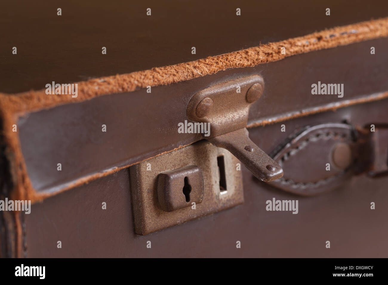 old fashioned leather handmade suitcase with latches lock and handle