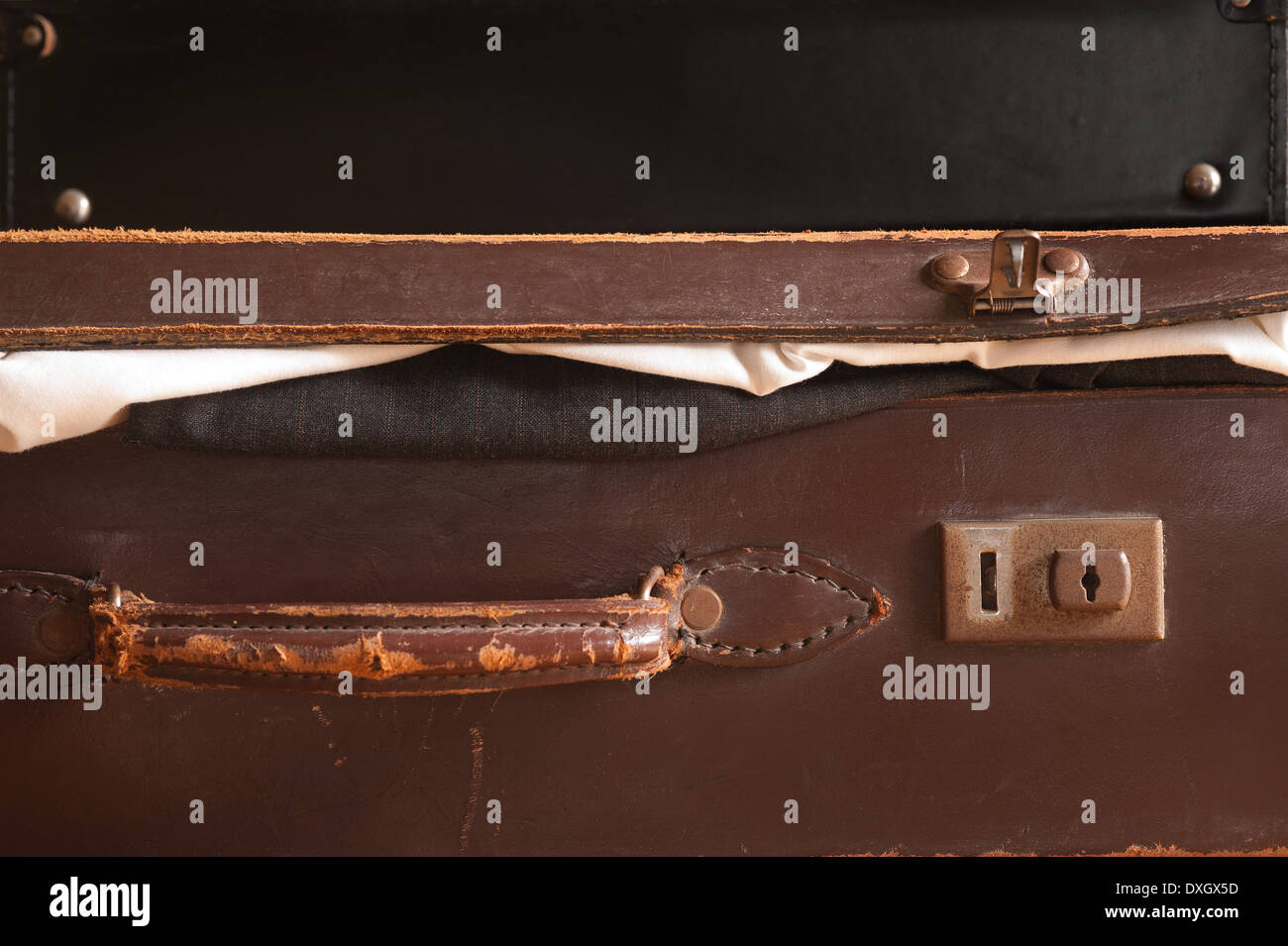 old fashioned leather handmade suitcase with latches lock and handle