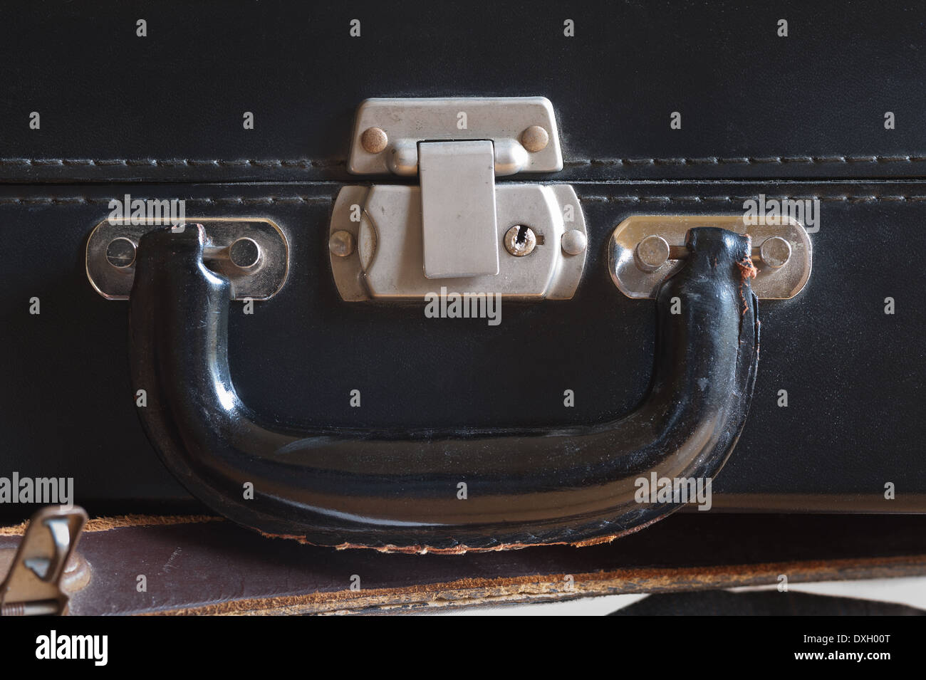 old fashioned leather handmade suitcase with latches lock and handle