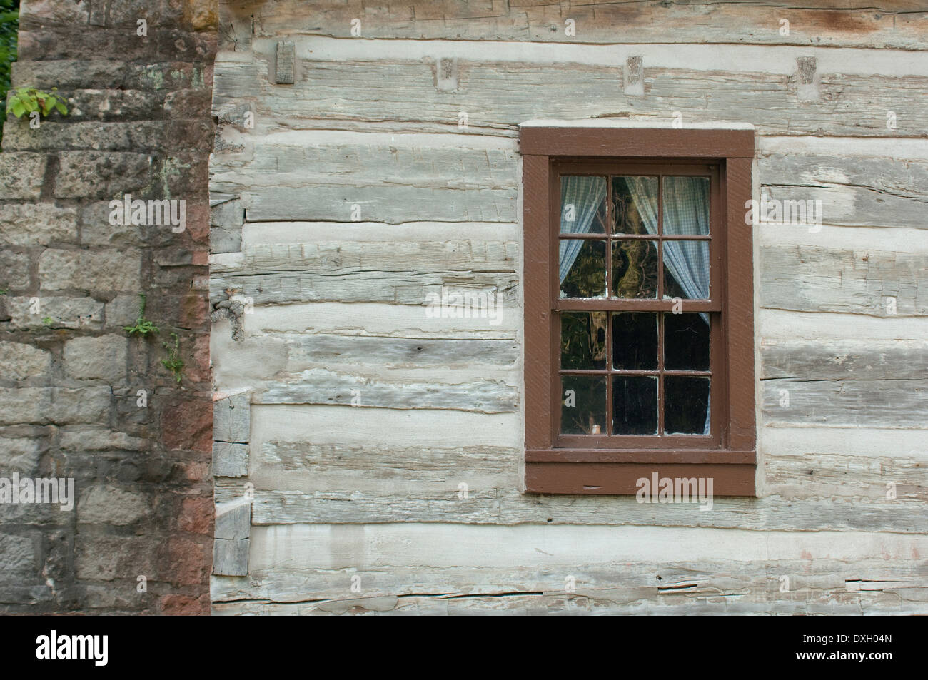 Window of a log home built in 1816, Spring Mill Pioneer Village, Indiana. Digital photograph Stock Photo