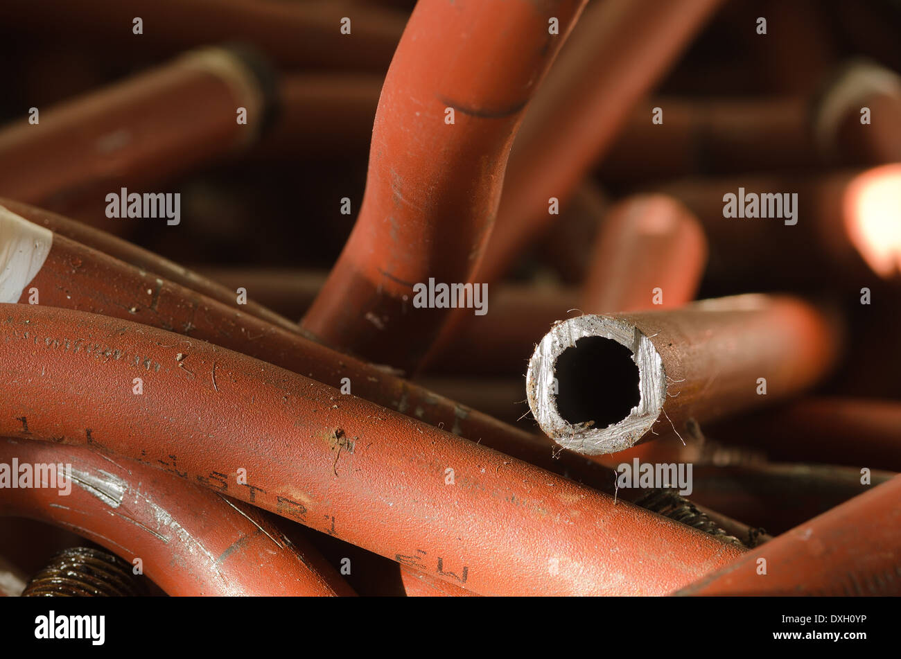 mass of iron steel plumbing pipe discarded and now scrap metal tubing soldered junction lead free Stock Photo