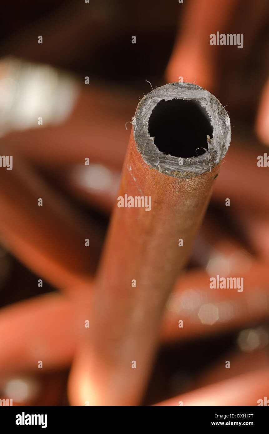 mass of iron steel plumbing pipe discarded and now scrap metal tubing soldered junction lead free Stock Photo