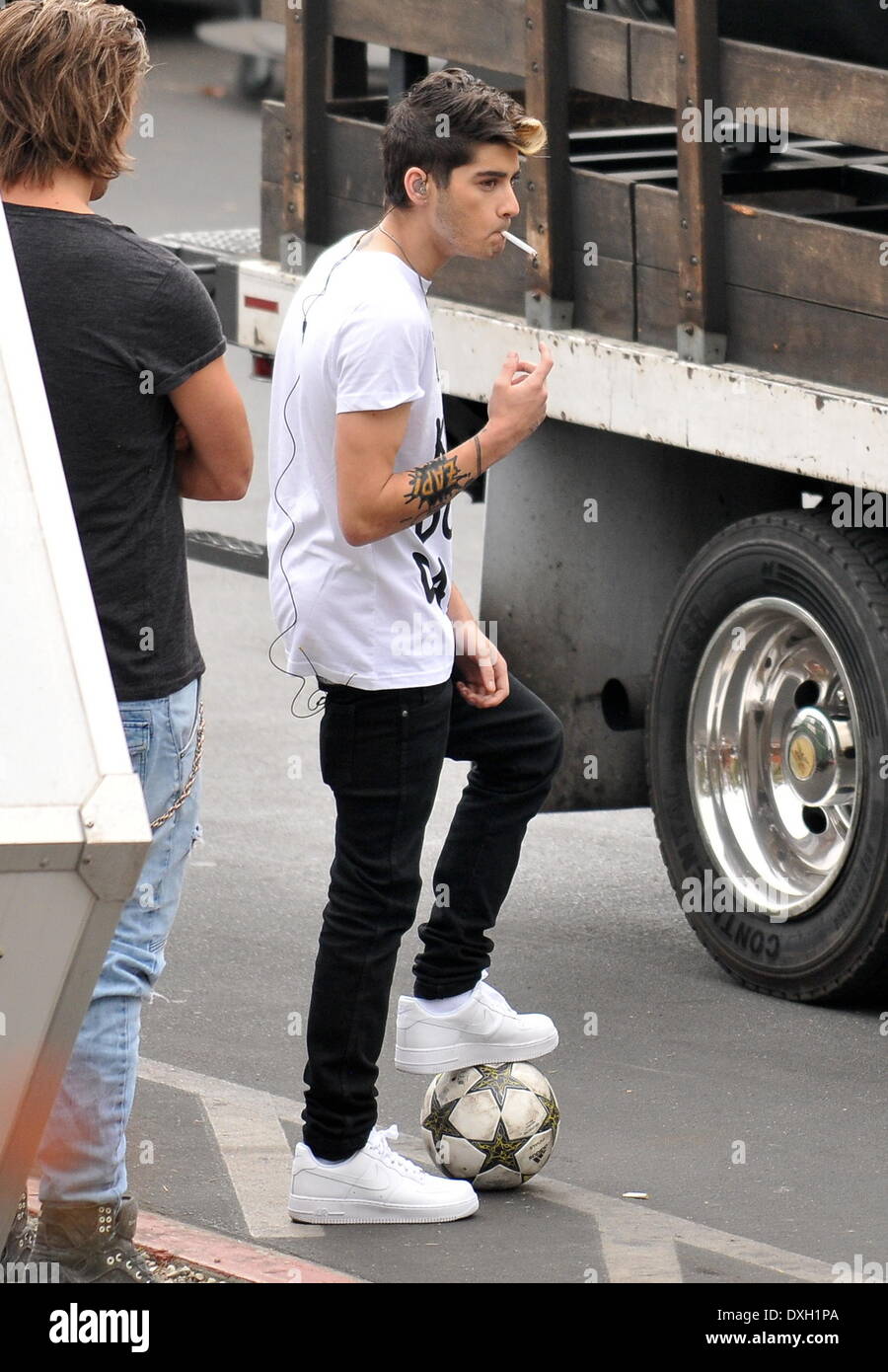 Zayn Malik smoking a cigarette One Direction band members playing Stock Photo 67986754 Alamy