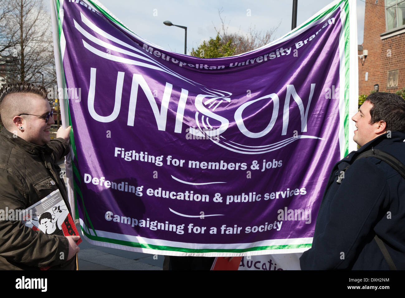 Manchester, UK  26th March, 2014.  Unison banner at the Teachers Day of Action.  Hundreds of teachers across the North West out on strike on Wednesday, forcing the closure of many schools.  The NUT are boycotting classes as part of an ongoing dispute over pay, pension cuts and working conditions. Teachers have been holding a number of rallies across the North West as part of their industrial action. Credit:  Marphotographics/Alamy Live News Stock Photo