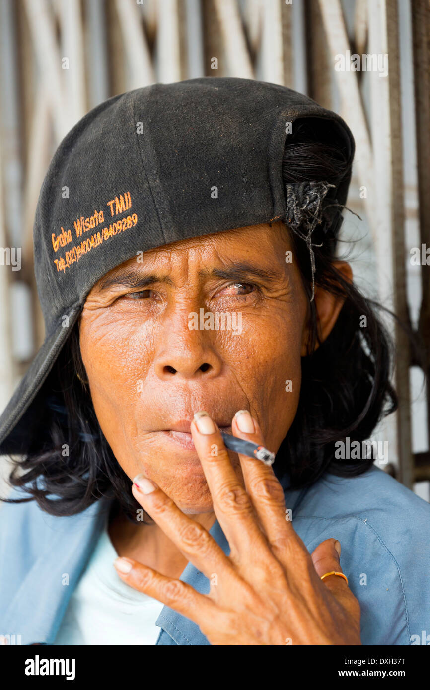 Woman smoking in Nagoya, Batam, Indonesia Stock Photo