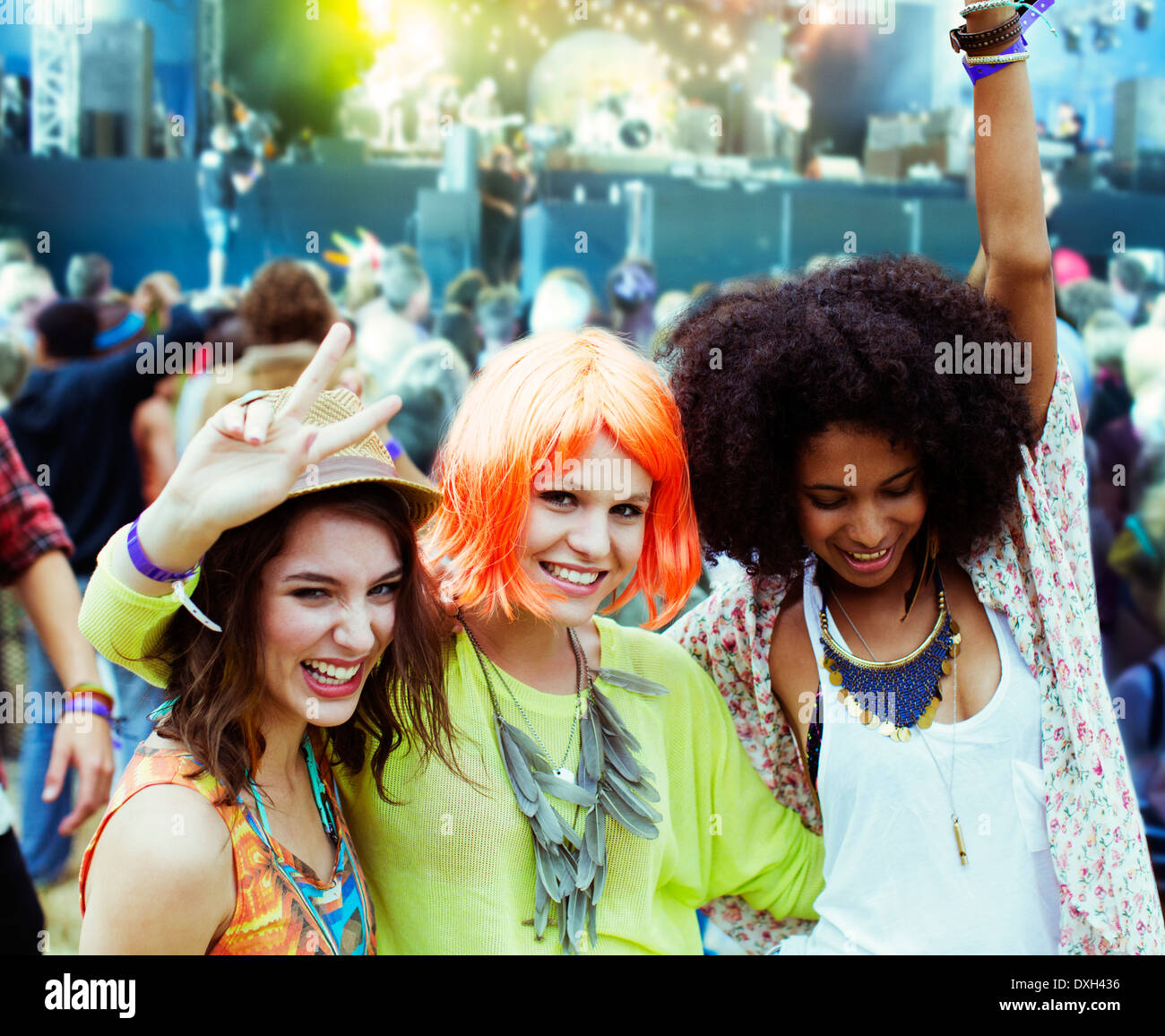 Portrait of cheering friends at music festival Stock Photo