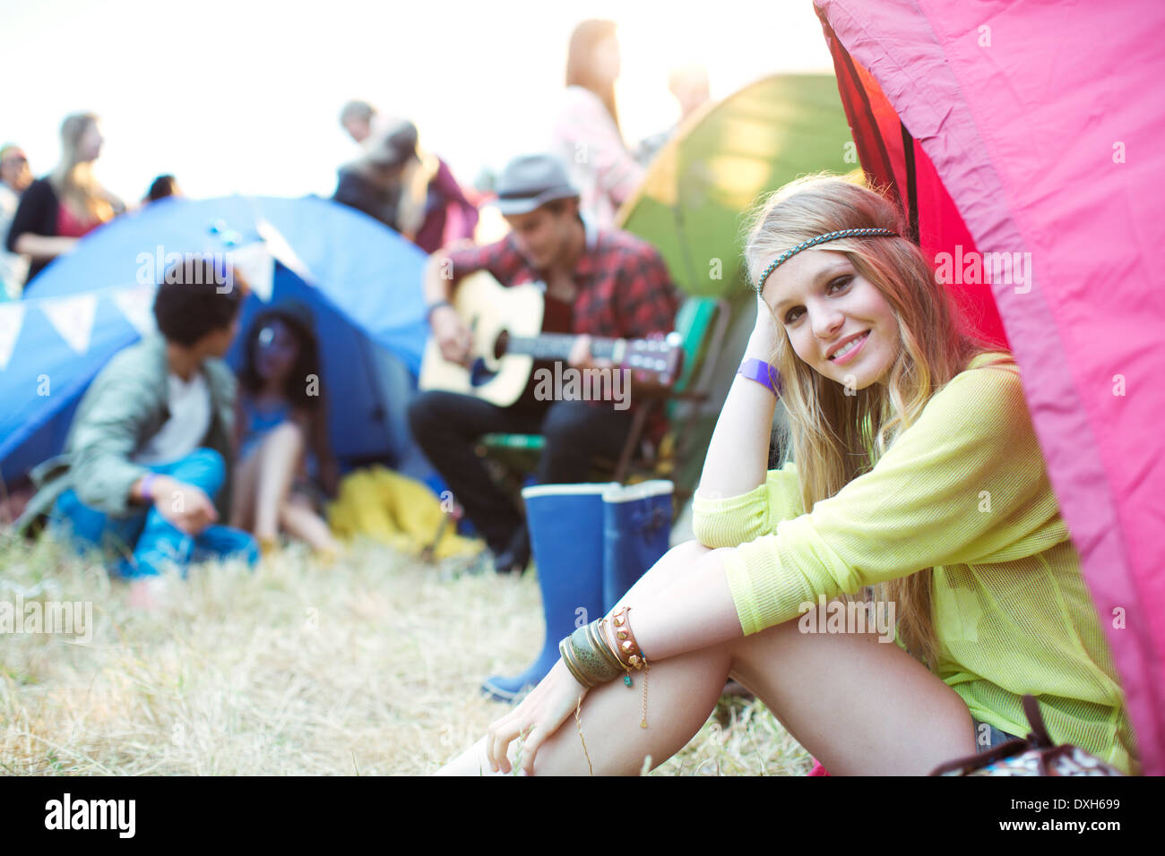 Portrait of smiling woman at tent at music festival Stock Photo