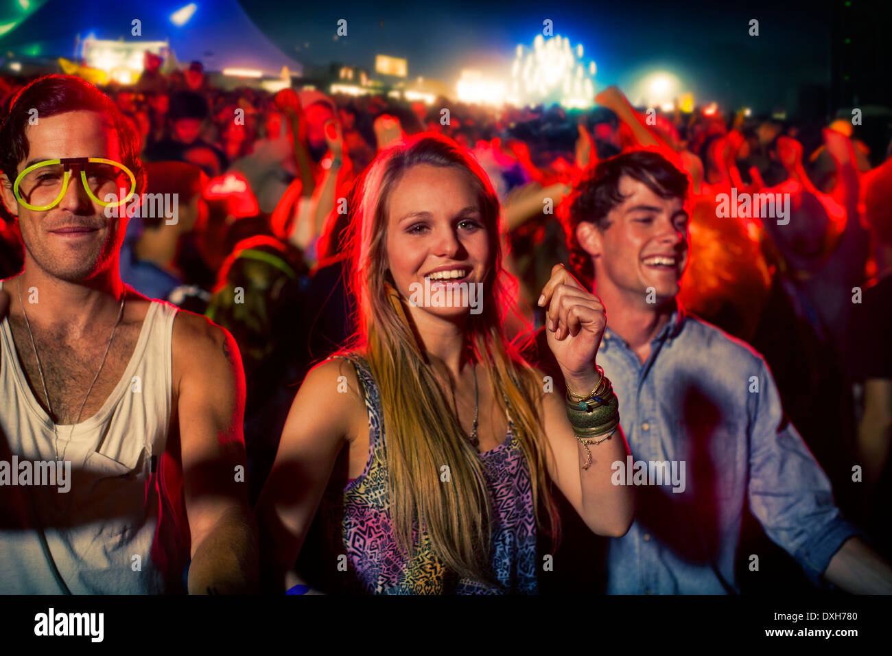 Fans dancing at music festival Stock Photo