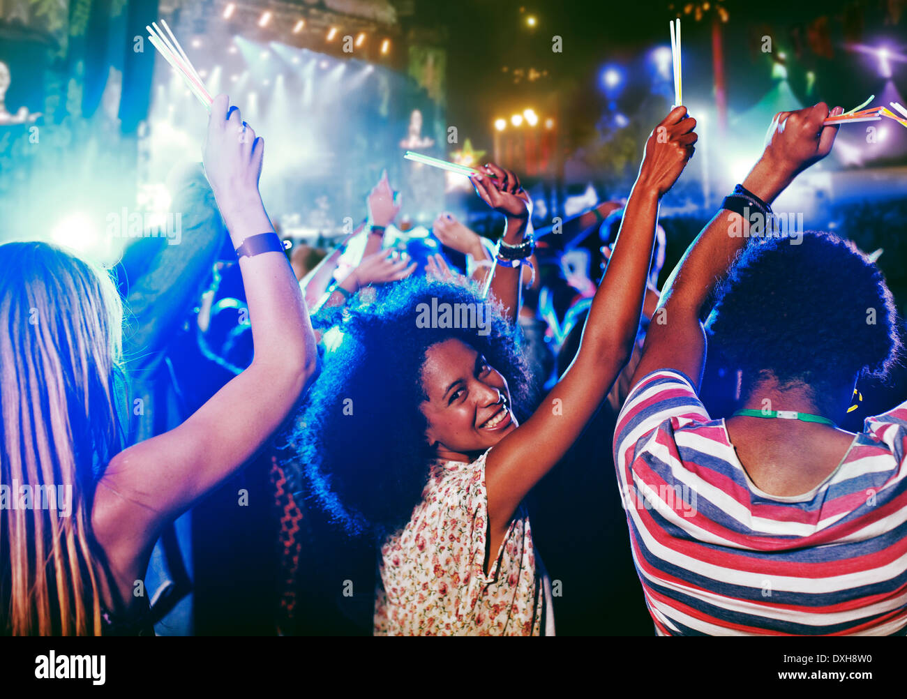 Portrait of cheering woman at music festival Stock Photo