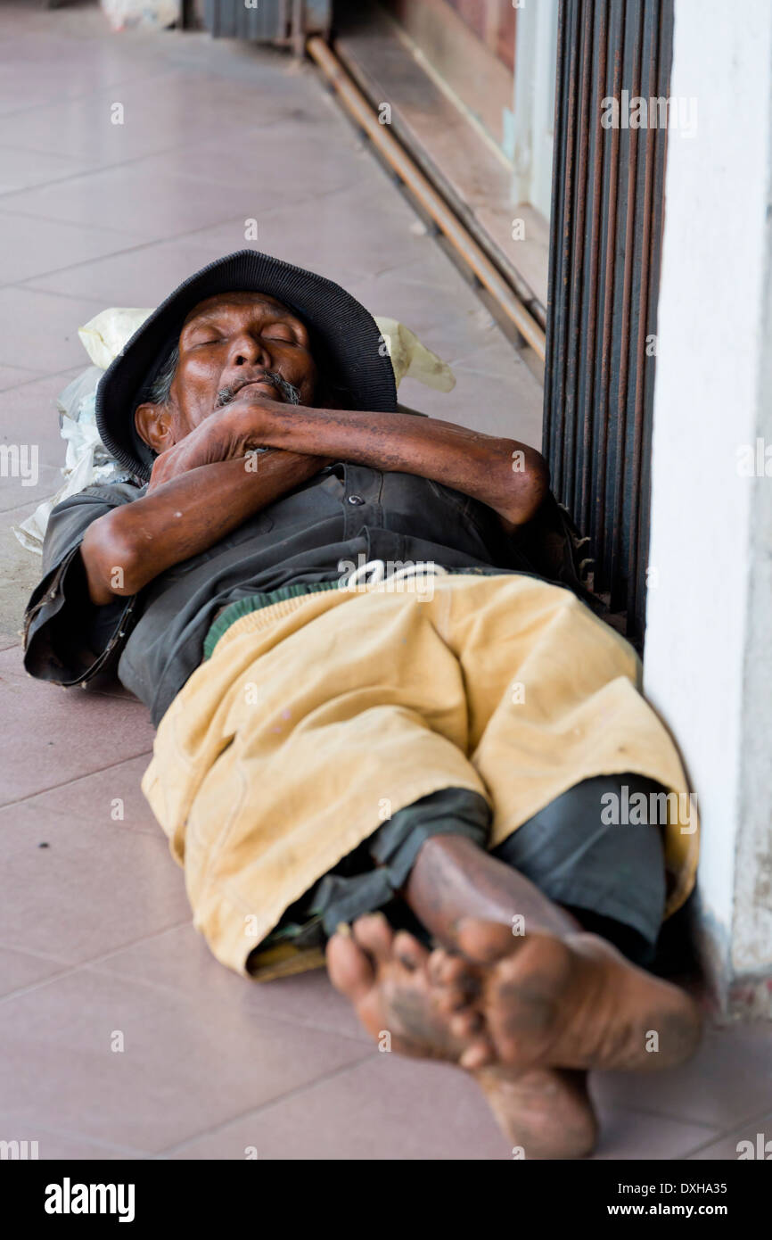 Man sleeping on the Walkway in Nagoya, Batam, Indonesia Stock Photo - Alamy