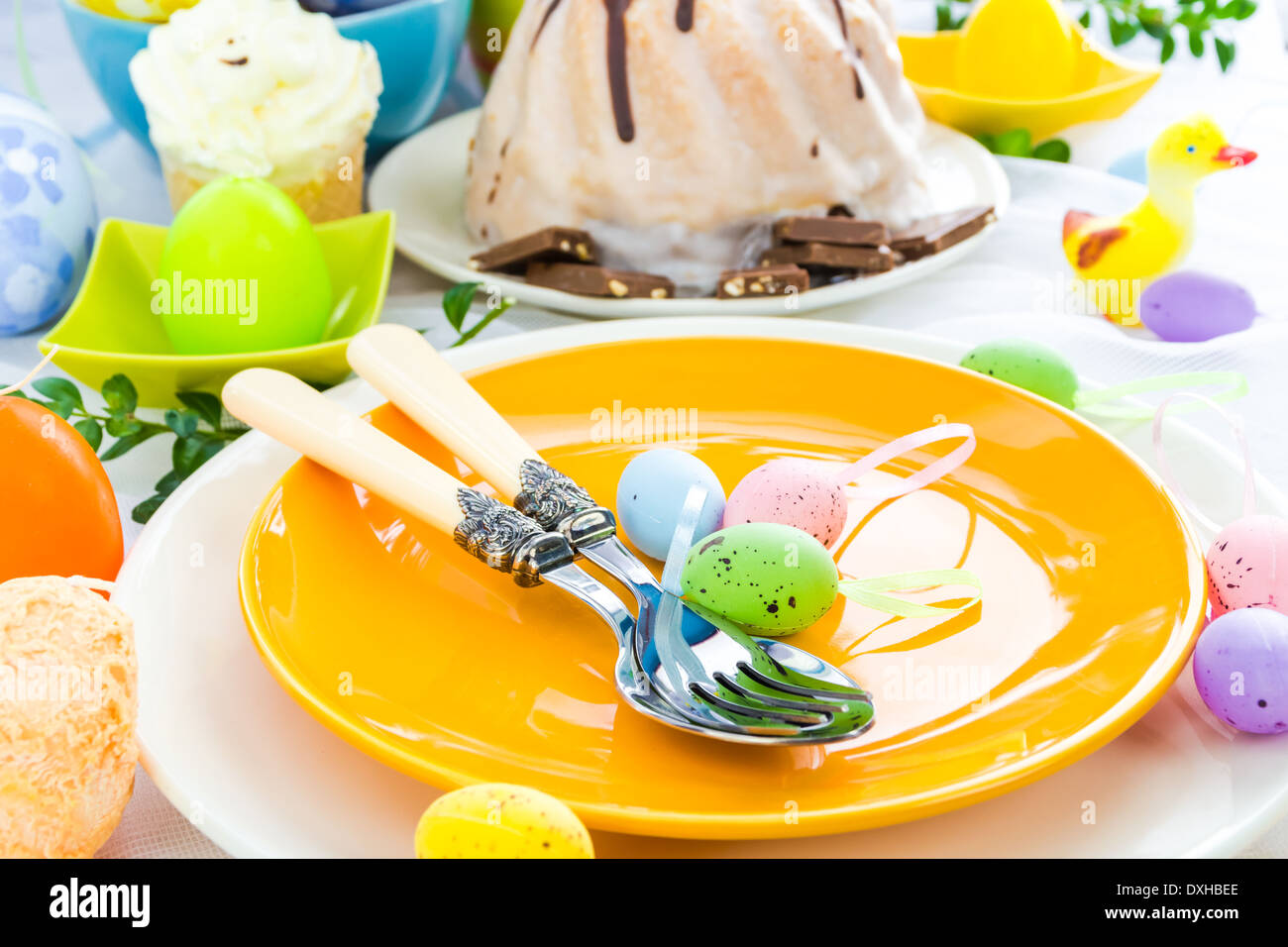 Easter table arrangement with eggs and sweets Stock Photo