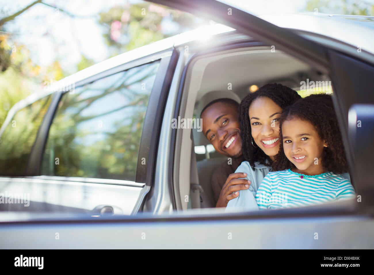 Portrait of happy family inside car Stock Photo