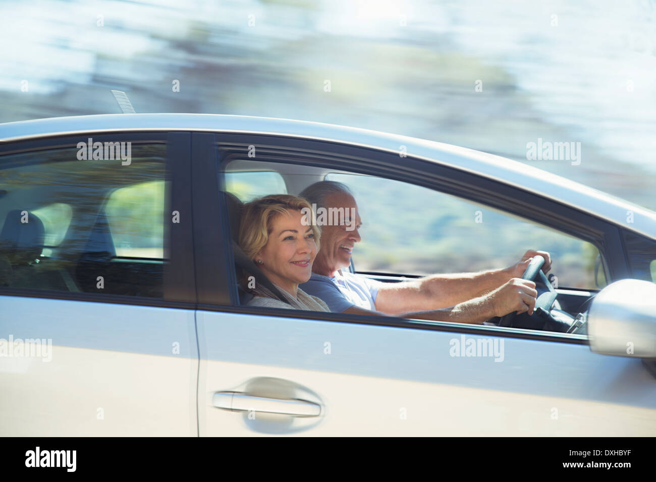 Happy senior couple driving in car Stock Photo