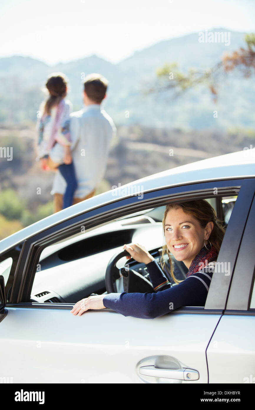 Portrait of smiling woman inside of car Stock Photo