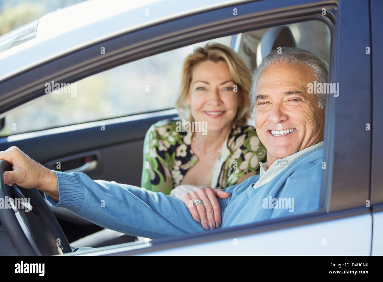 Portrait of happy senior couple in car Stock Photo