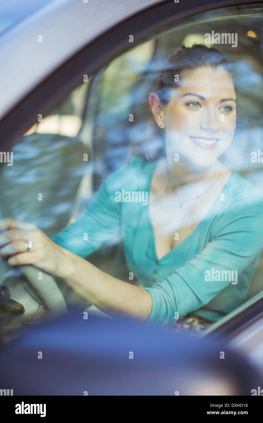 Happy woman driving car Stock Photo