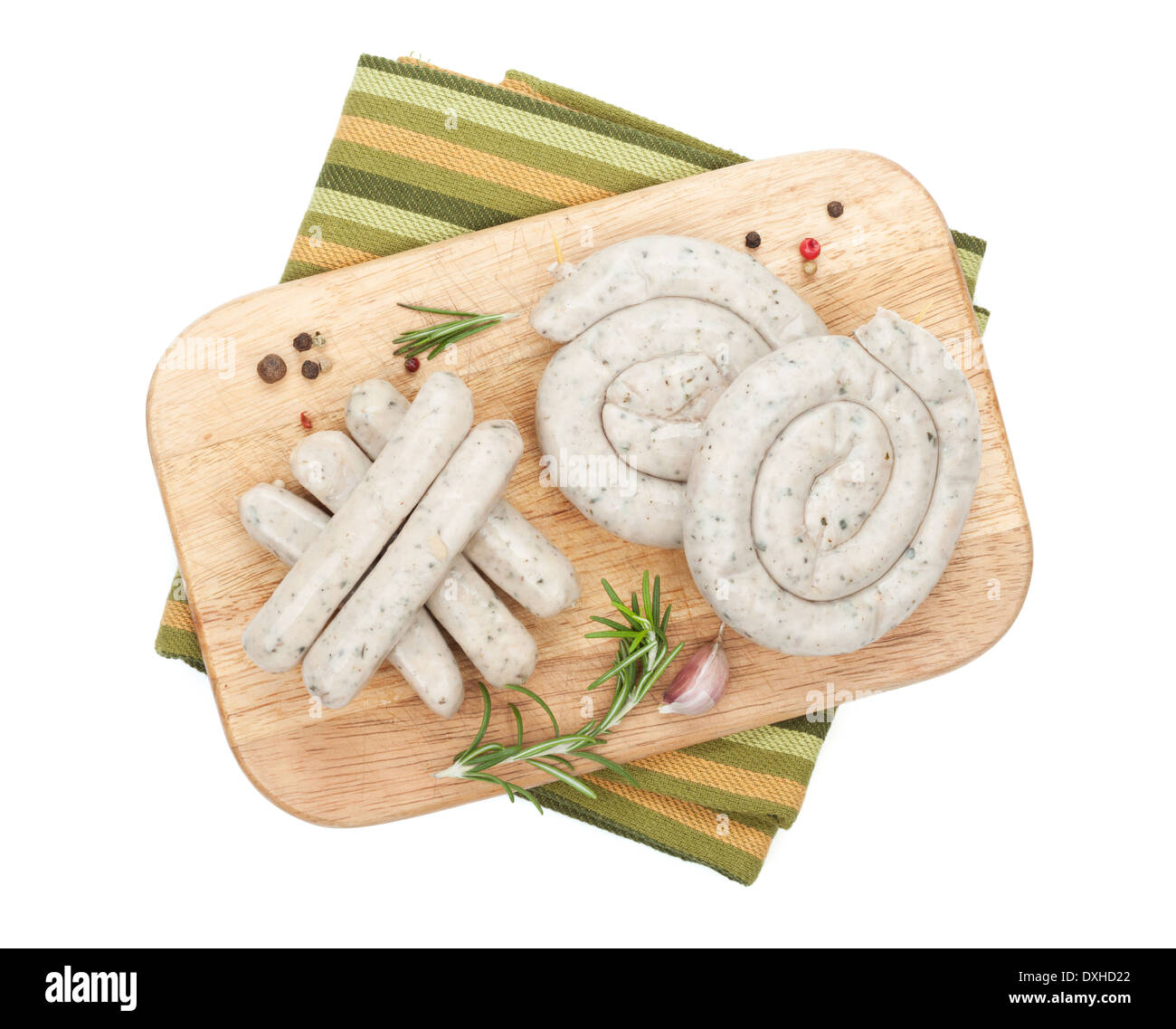 Raw sausages with spices. Isolated on white background Stock Photo