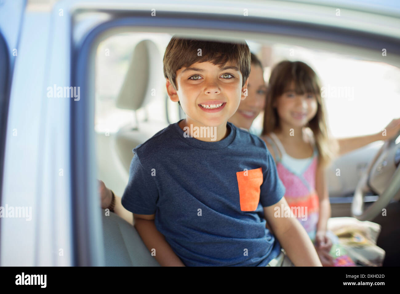 Portrait of smiling boy inside car Stock Photo