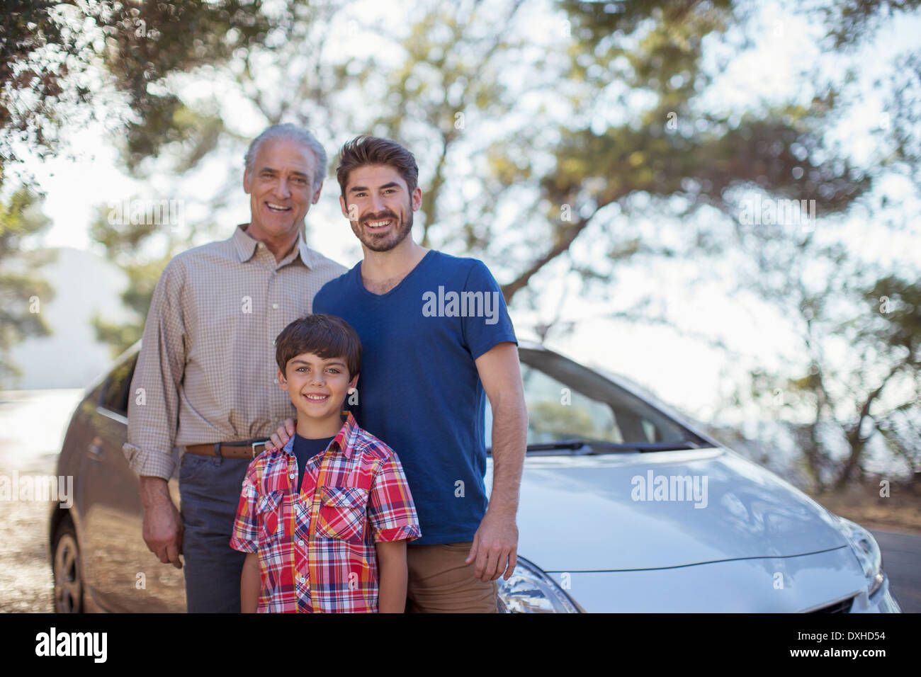 Portrait of multi-generation men outside car Stock Photo