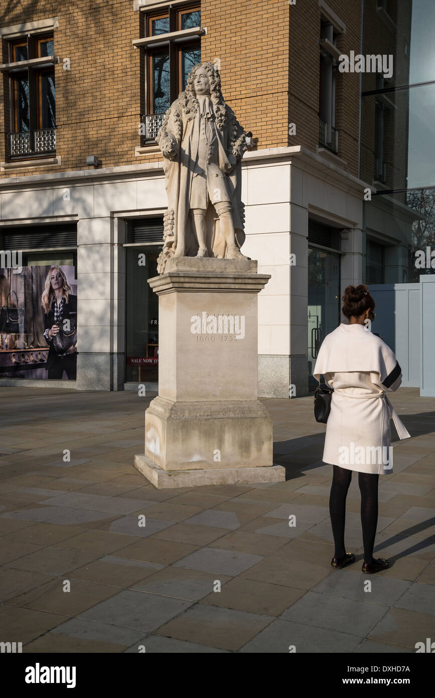 Sir Hans Sloane statue and woman with her back towards the camera, King's Rd, London, UK Stock Photo