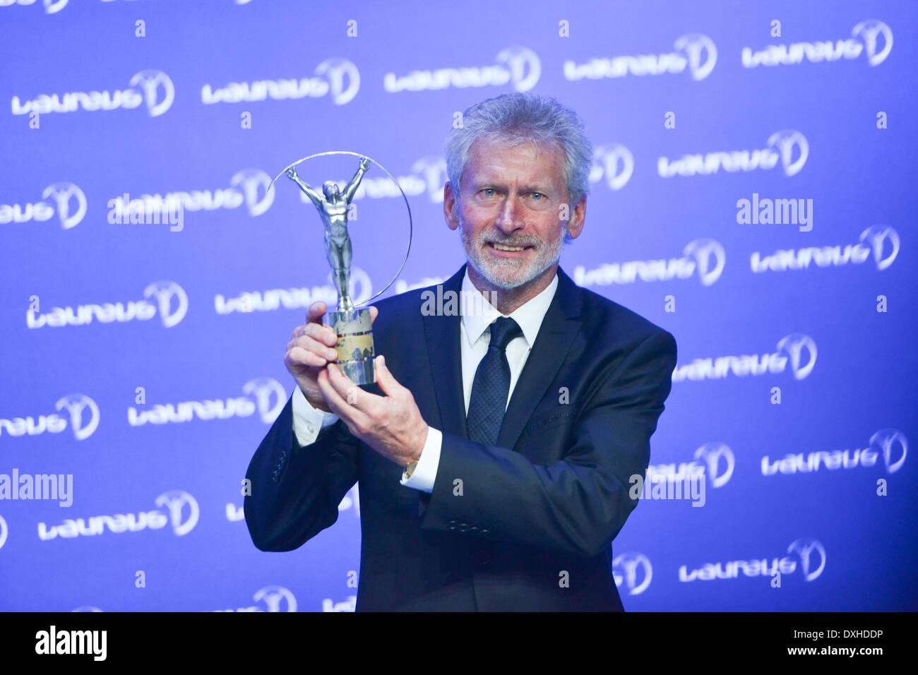 Kuala Lumpur. 26th Mar, 2014. Former football star Paul Breitner poses with the trophy for Team of the Year during the Laureus World Sports Awards ceremony on March 26, 2014, in Kuala Lumpur, Malaysia. Team Bayern Munich has been awarded as Team of the Year at the Laureus World Sports Awards ceremony. Credit:  Chong Voonchung/Xinhua/Alamy Live News Stock Photo