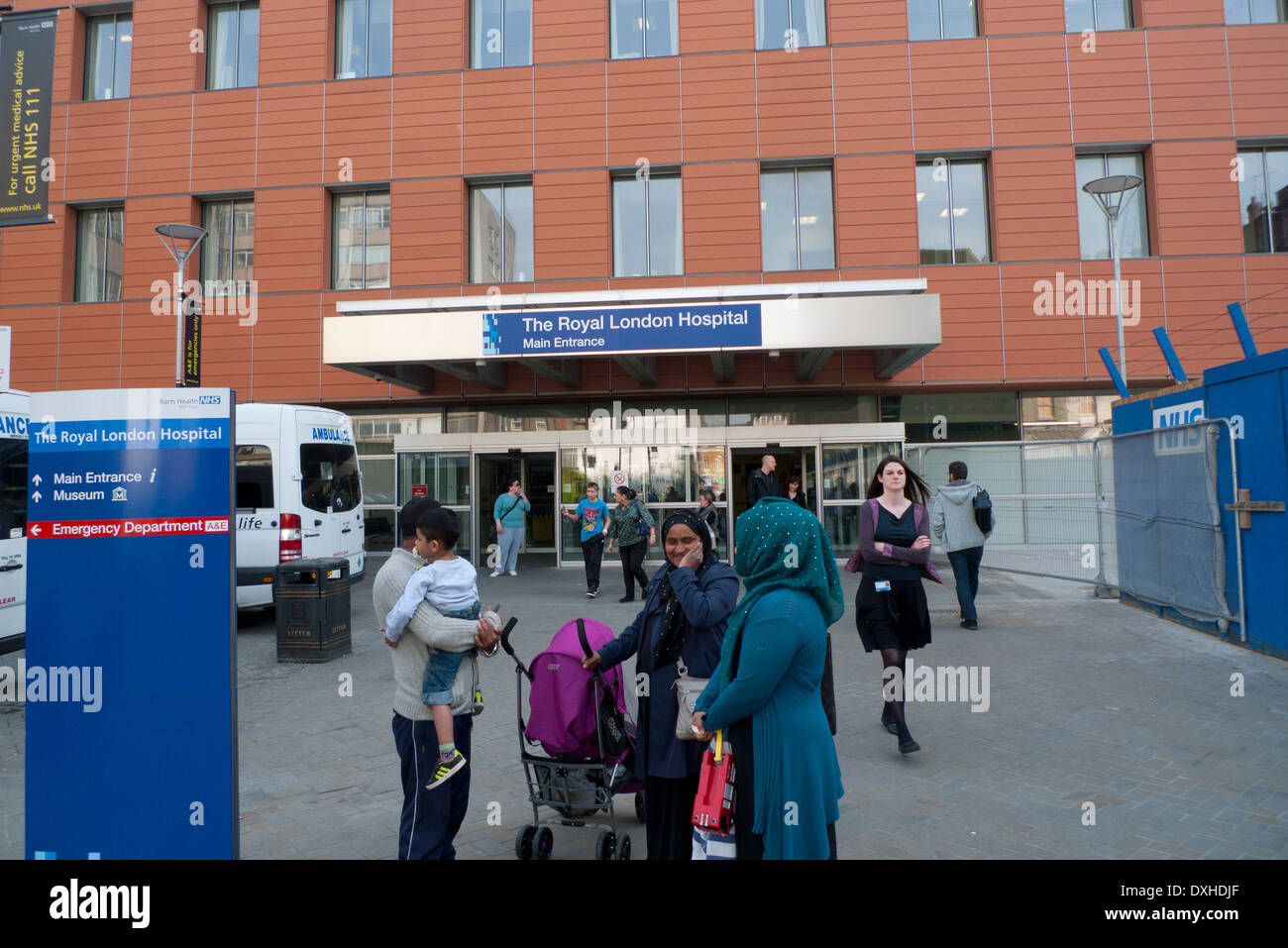 Muslim family talking outside the Royal London Hospital in Whitechapel East London, UK   KATHY DEWITT Stock Photo