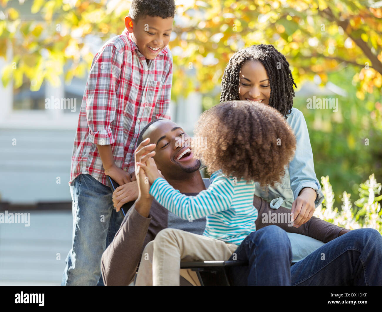 Happy family laughing outdoors Stock Photo